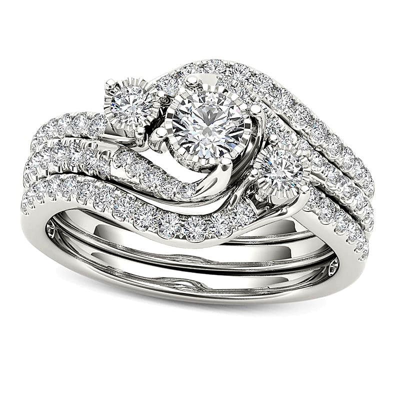 0.75 CT. TW Diamond Three Stone Bypass Three Piece Bridal Set in 14K White Gold