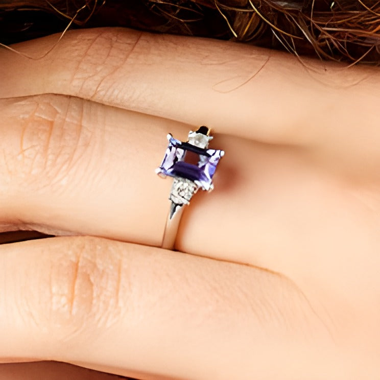 Emerald-Cut Tanzanite and 0.2 CT. TW Diamond Three Stone Ring in 14K White Gold