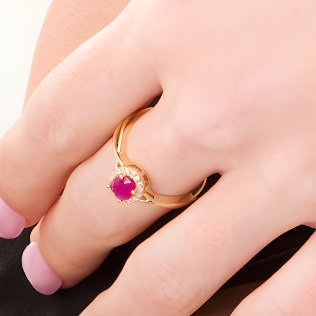 Oval Ruby and 0.07 CT. TW Diamond Frame Twist Shank Ring in 10K Gold