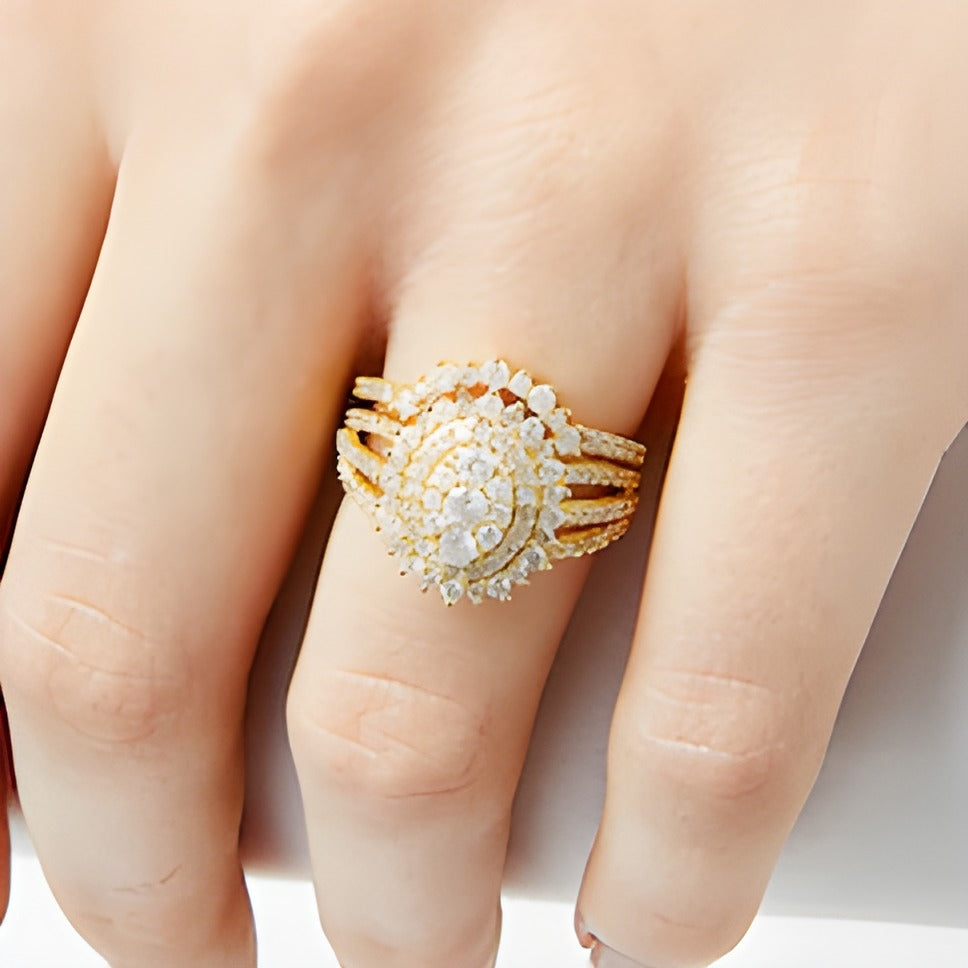 1.25 CT. TW Oval Multi-Diamond Sunburst Frame Split Shank Bridal Set in 10K Gold