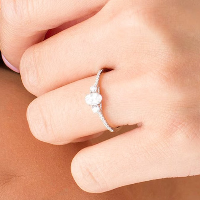 0.63 CT. TW Oval and Round Diamond Three Stone Engagement Ring in 14K White Gold