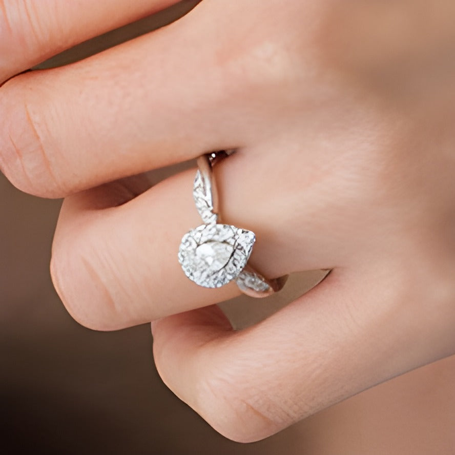 0.88 CT. TW Pear-Shaped Diamond Frame Twist Shank Engagement Ring in 10K White Gold