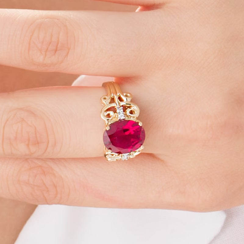 Oval Lab-Created Ruby and 0.05 CT. TW Diamond Vintage-Style Scroll Ring in 10K Gold