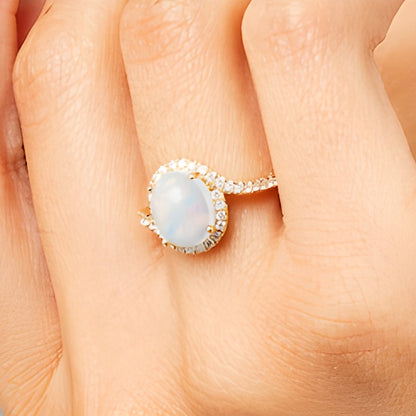 Oval Opal and 0.33 CT. TW Diamond Swirl Bypass Frame Ring in 10K Gold