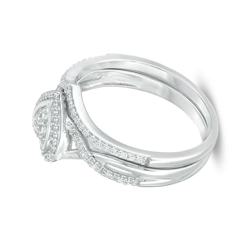 0.2 CT. TW Diamond Heart Frame Twist Bridal Set in 10K White Gold