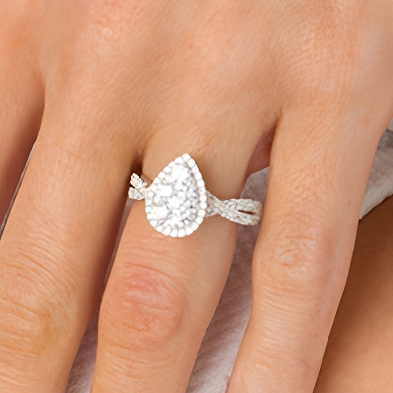 Previously Owned 1.25 CT. TW Composite Pear-Shaped Diamond Frame Twist Shank Engagement Ring in 14K White Gold