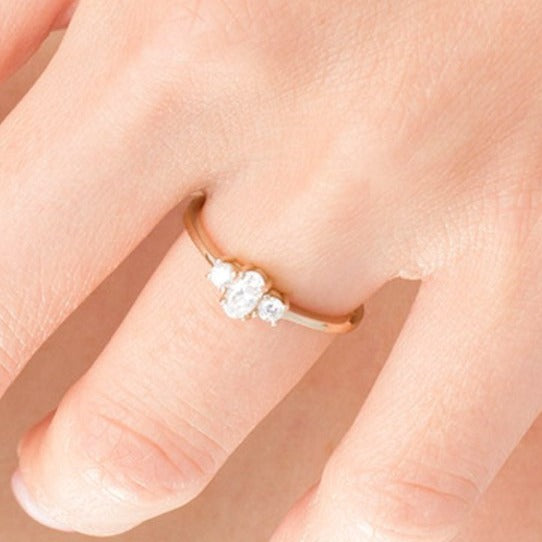 0.5 CT. TW Oval and Round Diamond Three Stone Engagement Ring in 14K Gold