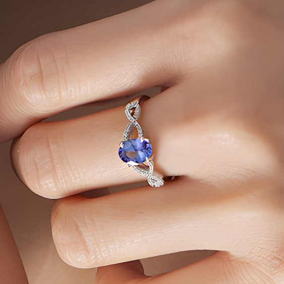 Oval Tanzanite and 0.07 CT. TW Diamond Twist Shank Ring in 10K White Gold