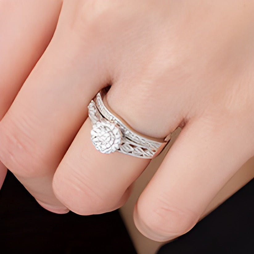 0.2 CT. TW Composite Diamond Flower Frame Vintage-Style Bridal Set in Sterling Silver