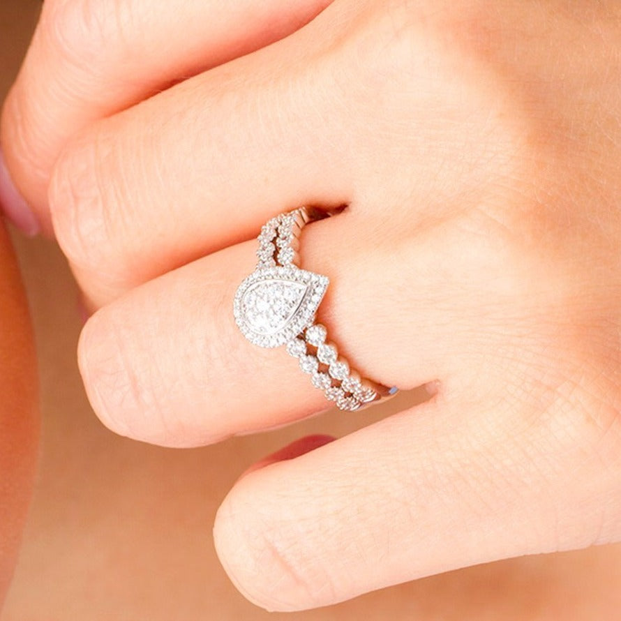 0.33 CT. TW Composite Diamond Pear-Shaped Frame Bridal Set in 10K White Gold