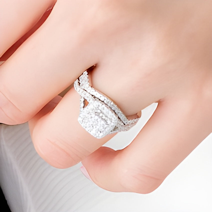 1.0 CT. TW Composite Diamond Cushion Frame Twist Shank Bridal Set in 10K White Gold
