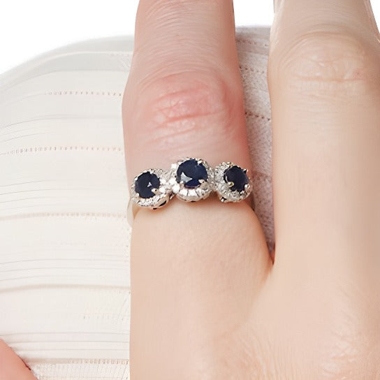 4.5mm Blue Sapphire and 0.2 CT. TW Diamond Three Stone Frame Ring in 14K White Gold