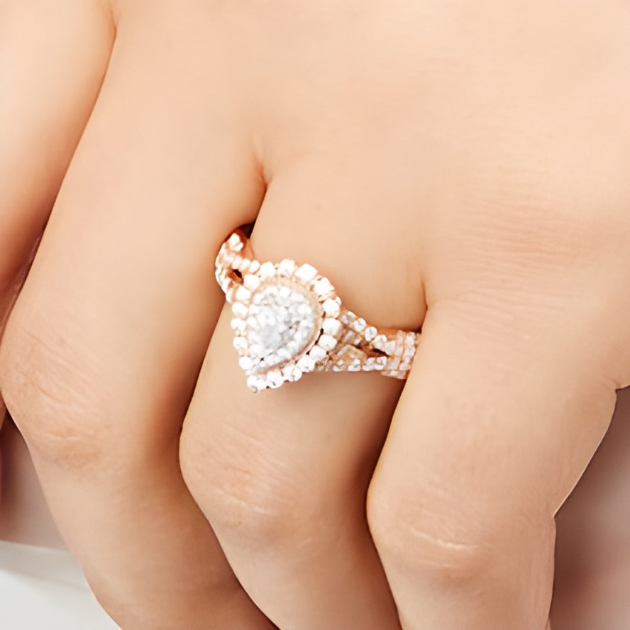 0.63 CT. TW Pear-Shaped Diamond Layered Twist Shank Engagement Ring in 10K Rose Gold