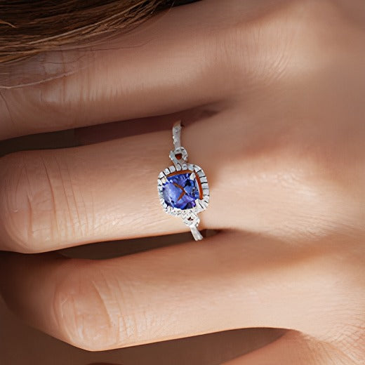 6.0mm Cushion-Cut Tanzanite and 0.17 CT. TW Diamond Frame Buckle Ring in 10K White Gold