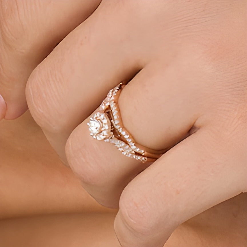 0.5 CT. TW Diamond Frame Twist Shank Bridal Set in 10K Rose Gold (I/I2)