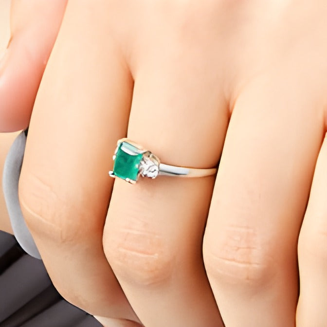 Emerald-Cut Emerald and 0.2 CT. TW Diamond Three Stone Ring in 14K White Gold