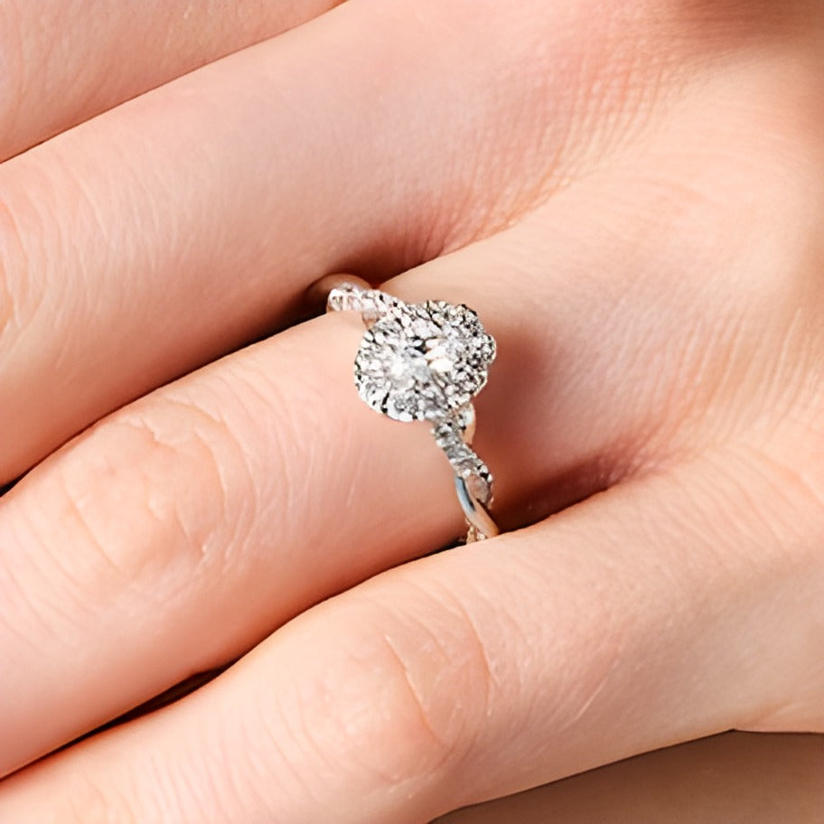 0.75 CT. TW Oval Diamond Frame Twist Shank Engagement Ring in 14K White Gold
