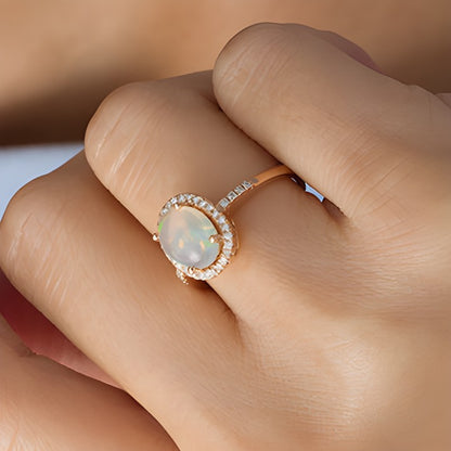 Oval Opal and 0.17 CT. TW Diamond Frame Ring in 14K Rose Gold