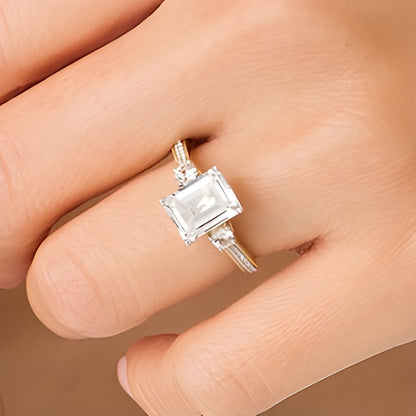 Emerald-Cut White Lab-Created Sapphire and 0.1 CT. TW Diamond Three Stone Engagement Ring in 14K Gold Over Silver