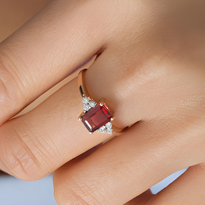 Emerald-Cut Garnet and 0.13 CT. TW Diamond Tri-Sides Engagement Ring in 10K Rose Gold