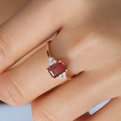 Emerald-Cut Garnet and 0.13 CT. TW Diamond Tri-Sides Engagement Ring in 10K Rose Gold
