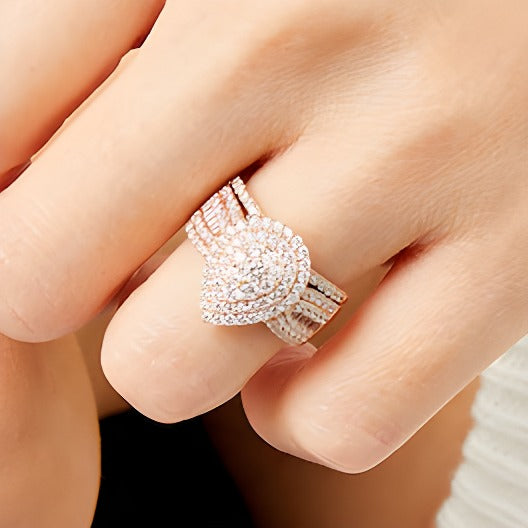 1.25 CT. TW Pear Multi-Diamond Teardrop Bow-Tie Bridal Set in 10K Rose Gold