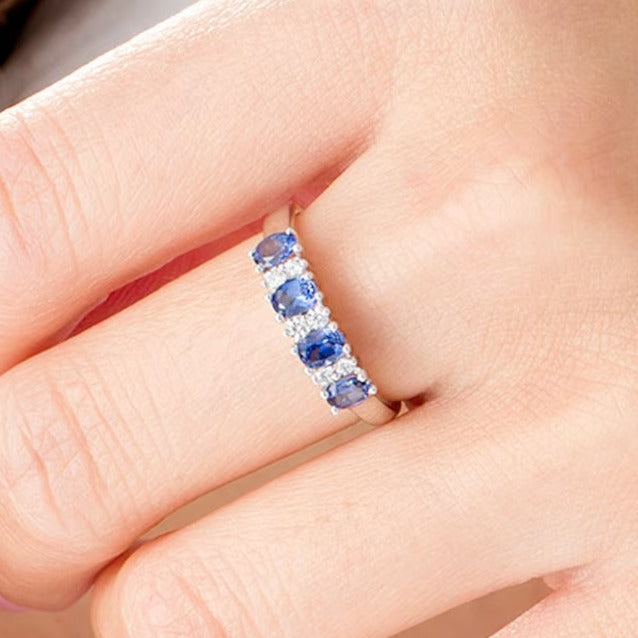 Oval Blue Sapphire and 0.1 CT. TW Diamond Duo Alternating Four Stone Ring in 14K White Gold