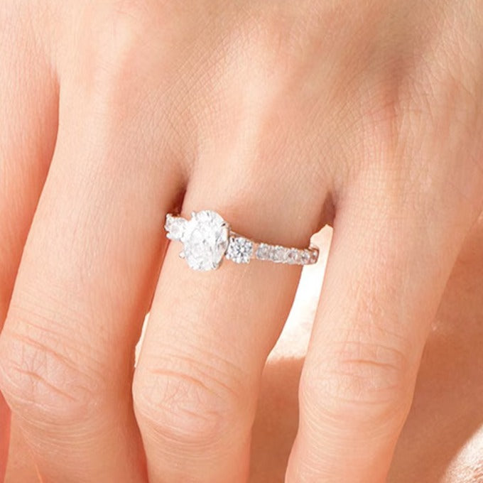 1.75 CT. TW Oval and Round Diamond Three Stone Engagement Ring in 14K White Gold