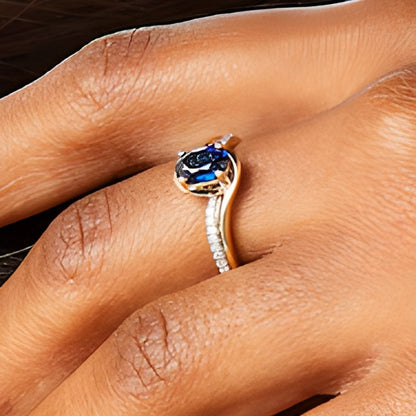 Oval Blue Lab-Created Sapphire and 0.1 CT. TW Diamond Bypass Ring in 10K Gold