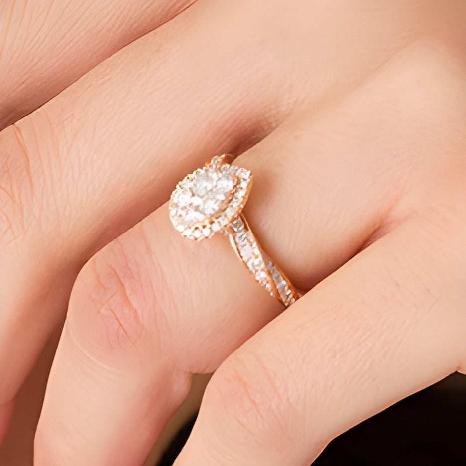 1.0 CT. TW Composite Pear Diamond Frame Twist Shank Engagement Ring in 14K Rose Gold