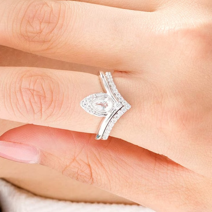 Pear-Shaped Lab-Created White Sapphire and 0.33 CT. TW Diamond Chevron Bridal Set in 10K White Gold