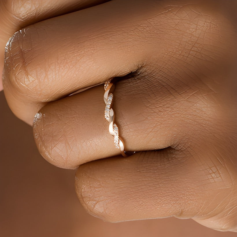0.05 CT. TW Diamond Twist Wedding Band in 10K Rose Gold