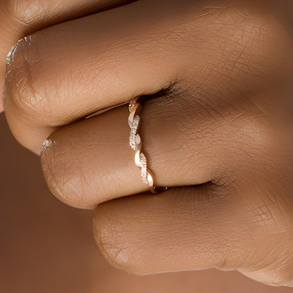 0.05 CT. TW Diamond Twist Wedding Band in 10K Rose Gold