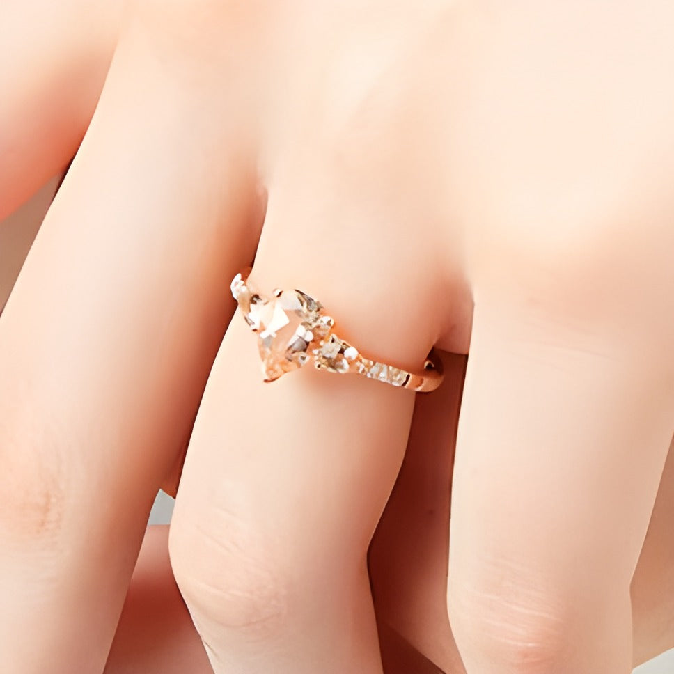 Pear-Shaped Morganite and 0.07 CT. TW Diamond Three Stone Ring in 10K Rose Gold