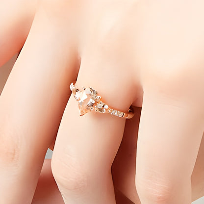 Pear-Shaped Morganite and 0.07 CT. TW Diamond Three Stone Ring in 10K Rose Gold