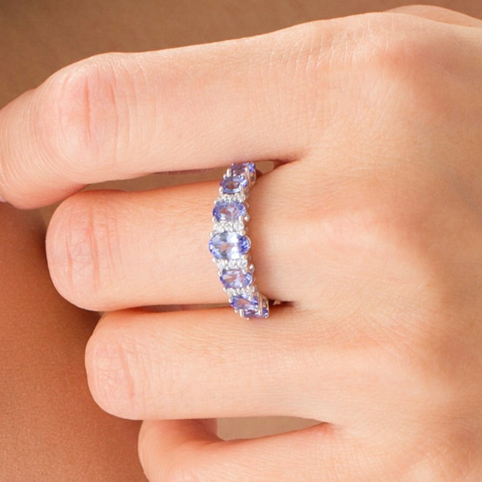 Oval Tanzanite and 0.13 CT. TW Diamond Graduated Seven Stone Ring in 10K White Gold