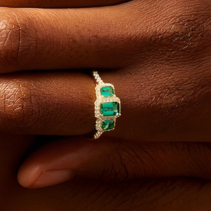Emerald-Cut Lab-Created Emerald and 0.25 CT. TW Diamond Frame Three Stone Ring in 10K Gold