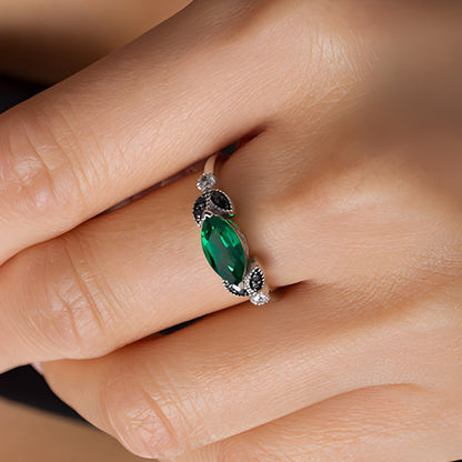 Sideways Marquise Lab-Created Emerald and 0.1 CT. TW Enhanced Black and White Diamond Leaves Ring in 10K White Gold
