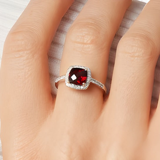7.0mm Cushion-Shaped Garnet and 0.2 CT. TW Diamond Frame Ring in 10K Gold