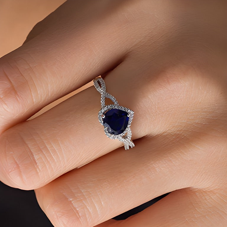 7.0mm Heart-Shaped Lab-Created Blue Sapphire and 0.2 CT. TW Diamond Frame Crossover Ring in 10K White Gold