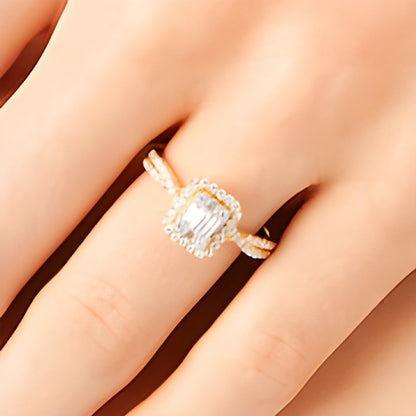 0.5 CT. TW Emerald-Shaped Multi-Diamond Frame Twist Shank Engagement Ring in 10K Gold