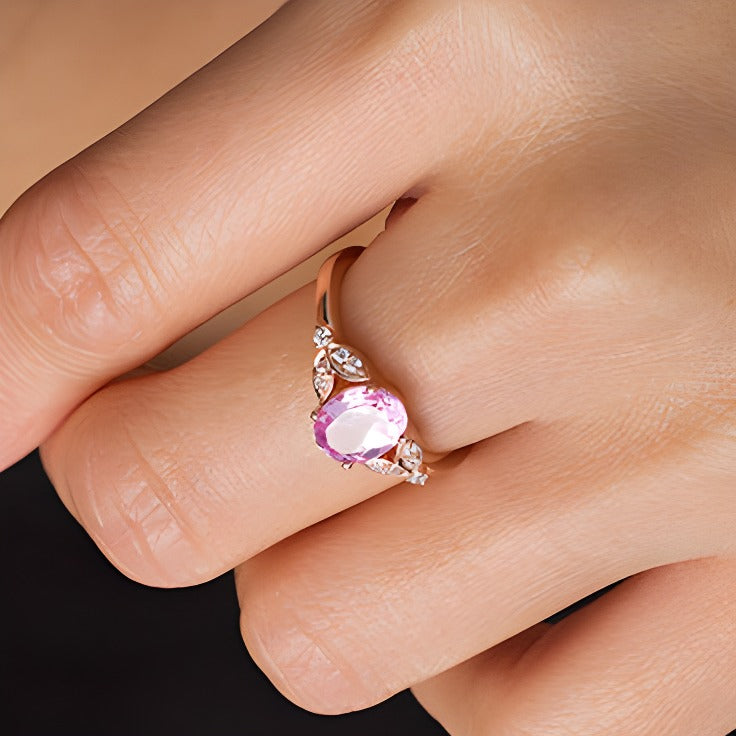 Oval Lab-Created Pink Sapphire and 0.1 CT. TW Diamond Leaf Sides Ring in 10K Rose Gold