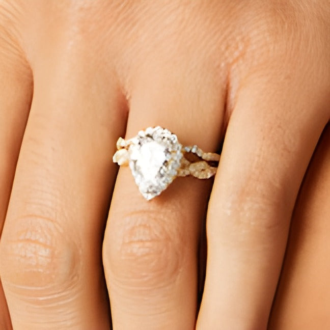 2.63 CT. TW Pear-Shaped Lab-Grown Diamond Frame Twist Shank Bridal Set in 14K Gold (I/SI2)