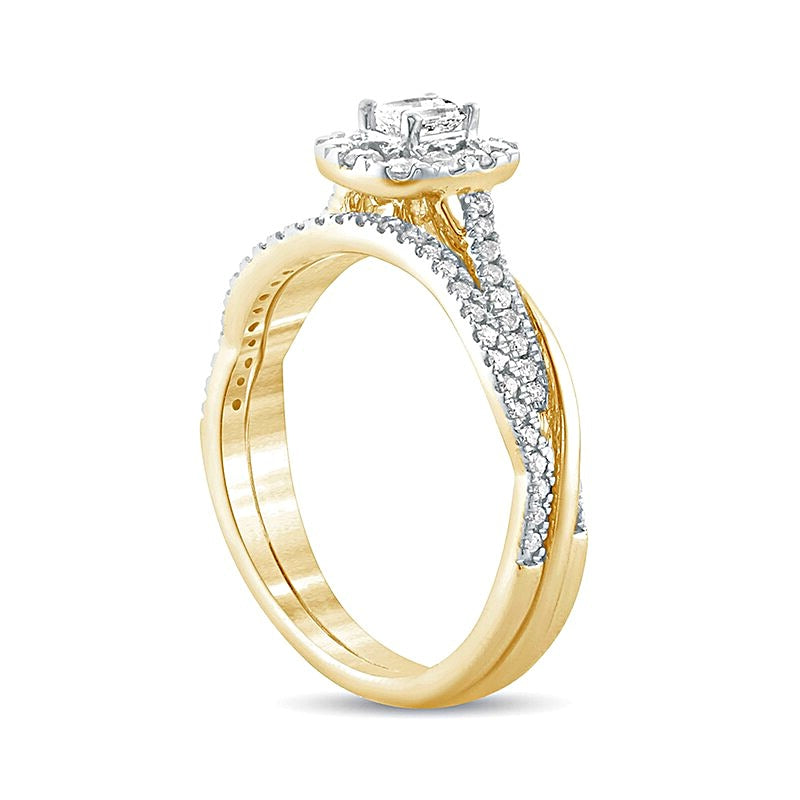 0.5 CT. TW Emerald-Cut Diamond Frame Twist Shank Bridal Set in 10K Gold
