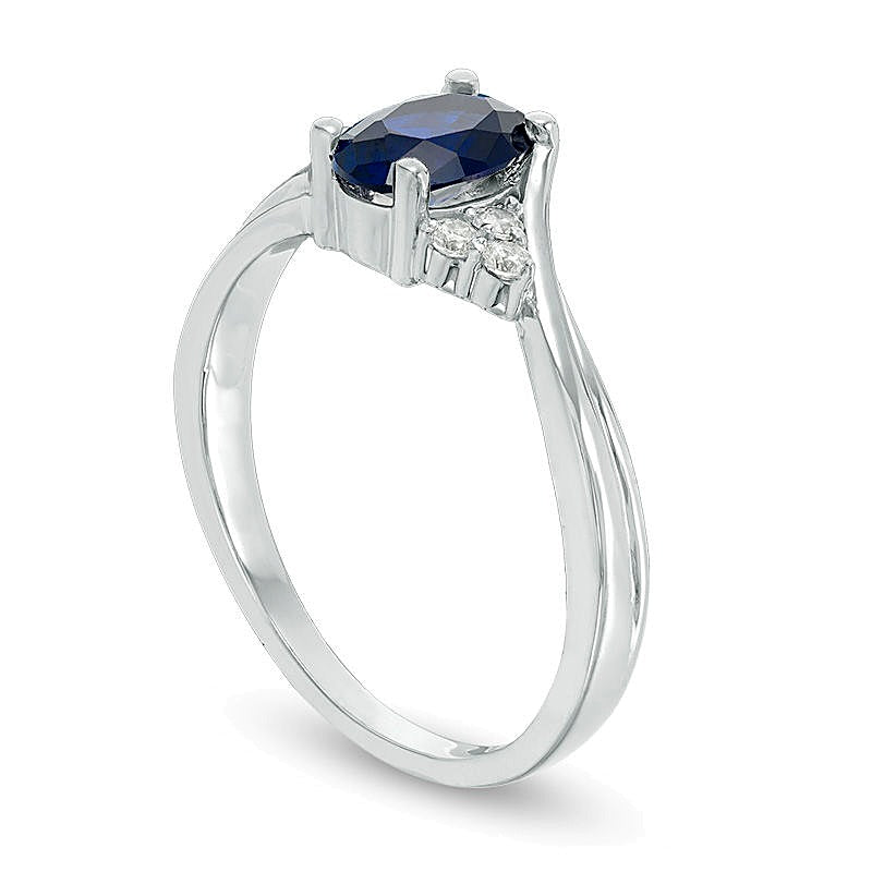 Oval Lab-Created Blue Sapphire and 0.1 CT. TW Diamond Tri-Sides Promise Ring in 10K White Gold