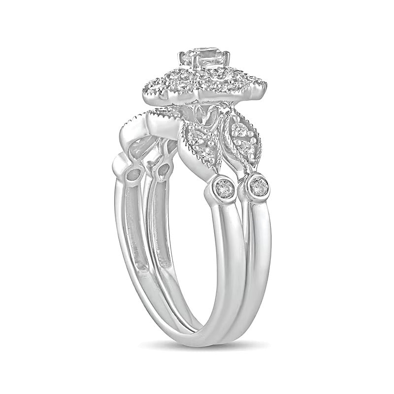 0.63 CT. TW Oval Diamond Double Petal Frame Vintage-Style Bridal Set in 10K White Gold