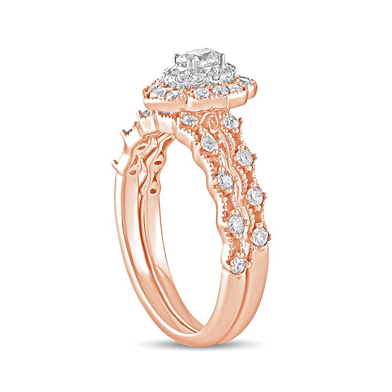 0.63 CT. TW Oval Diamond Frame Vintage-Style Bridal Set in 10K Rose Gold
