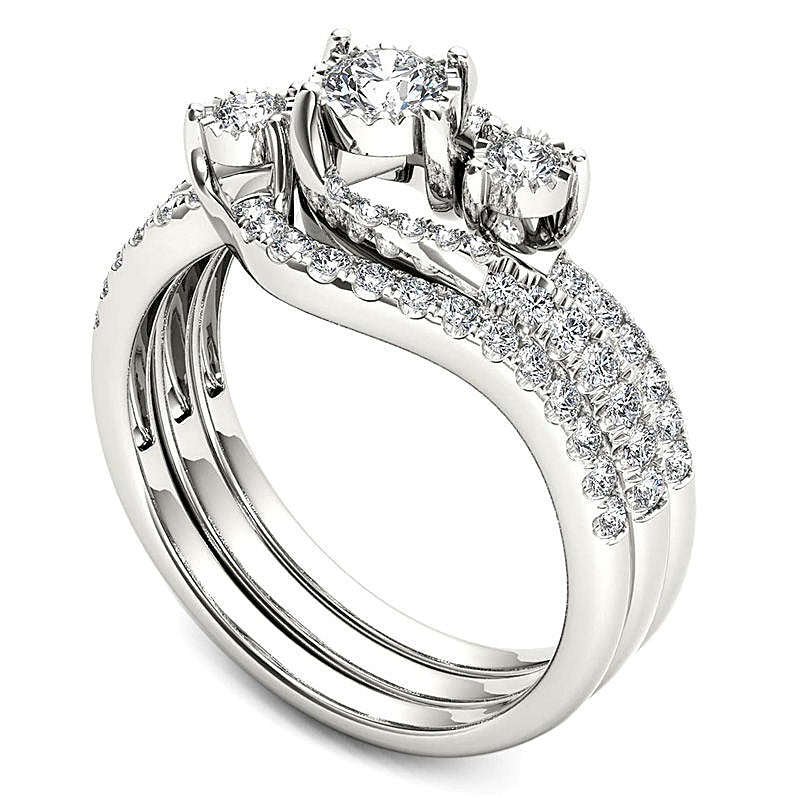 0.75 CT. TW Diamond Three Stone Bypass Three Piece Bridal Set in 14K White Gold