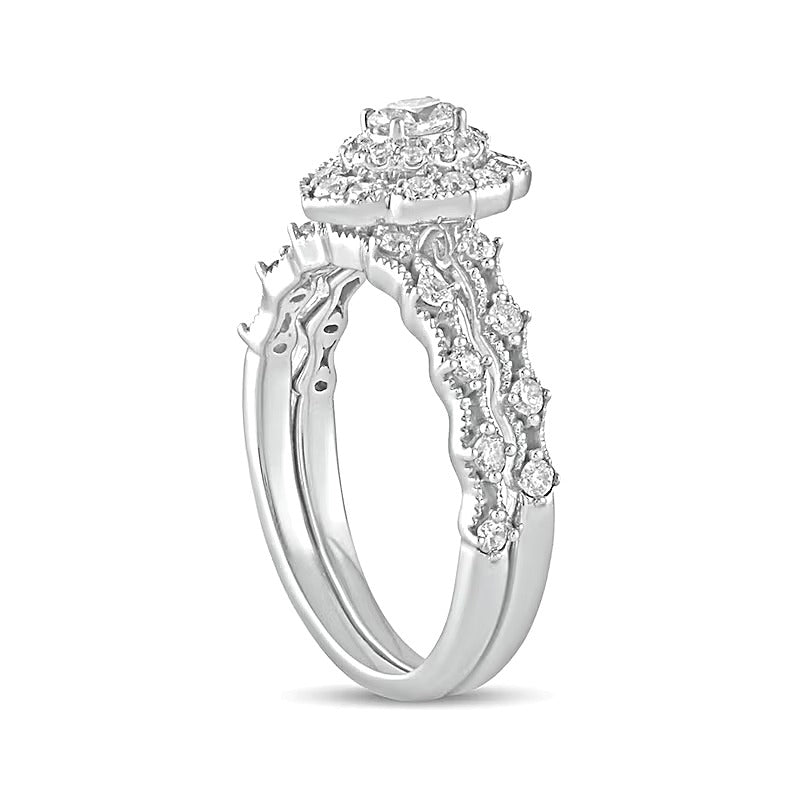 0.63 CT. TW Oval Diamond Frame Vintage-Style Bridal Set in 10K White Gold