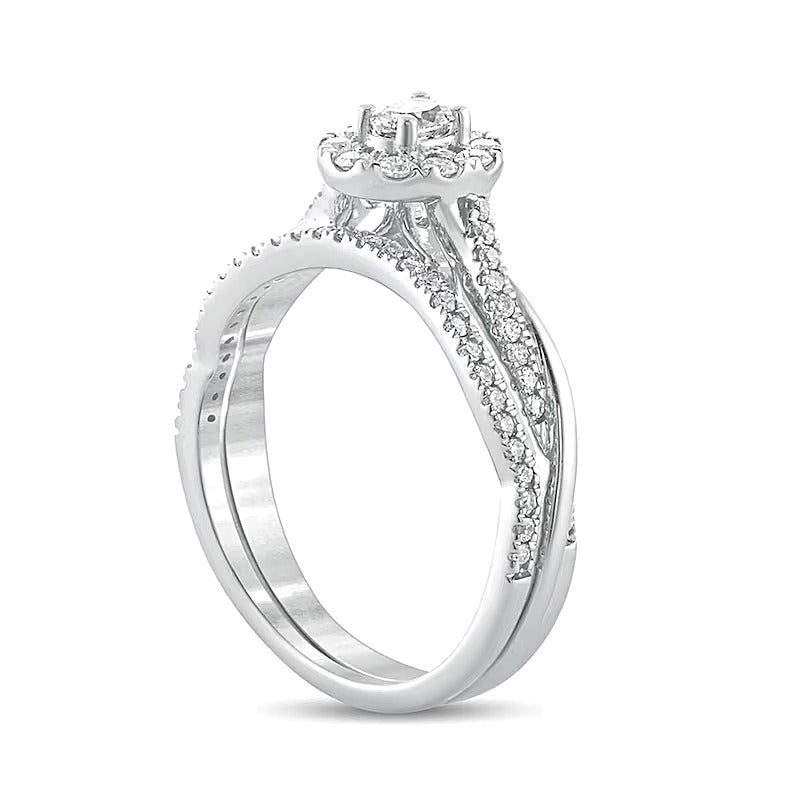 0.5 CT. TW Oval Diamond Frame Twist Shank Bridal Set in 10K White Gold